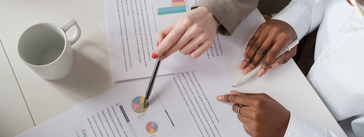 Two people looking at documents.