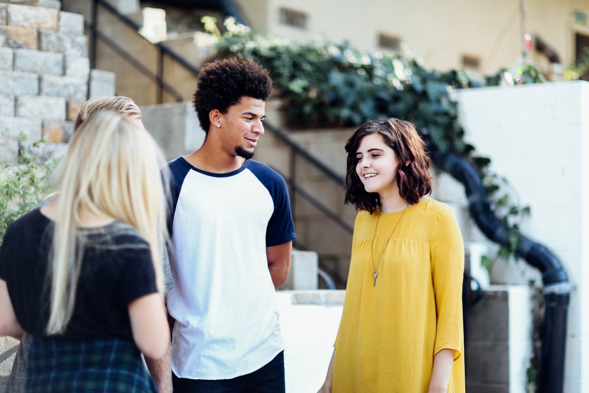 Diverse teens talking and supporting each other