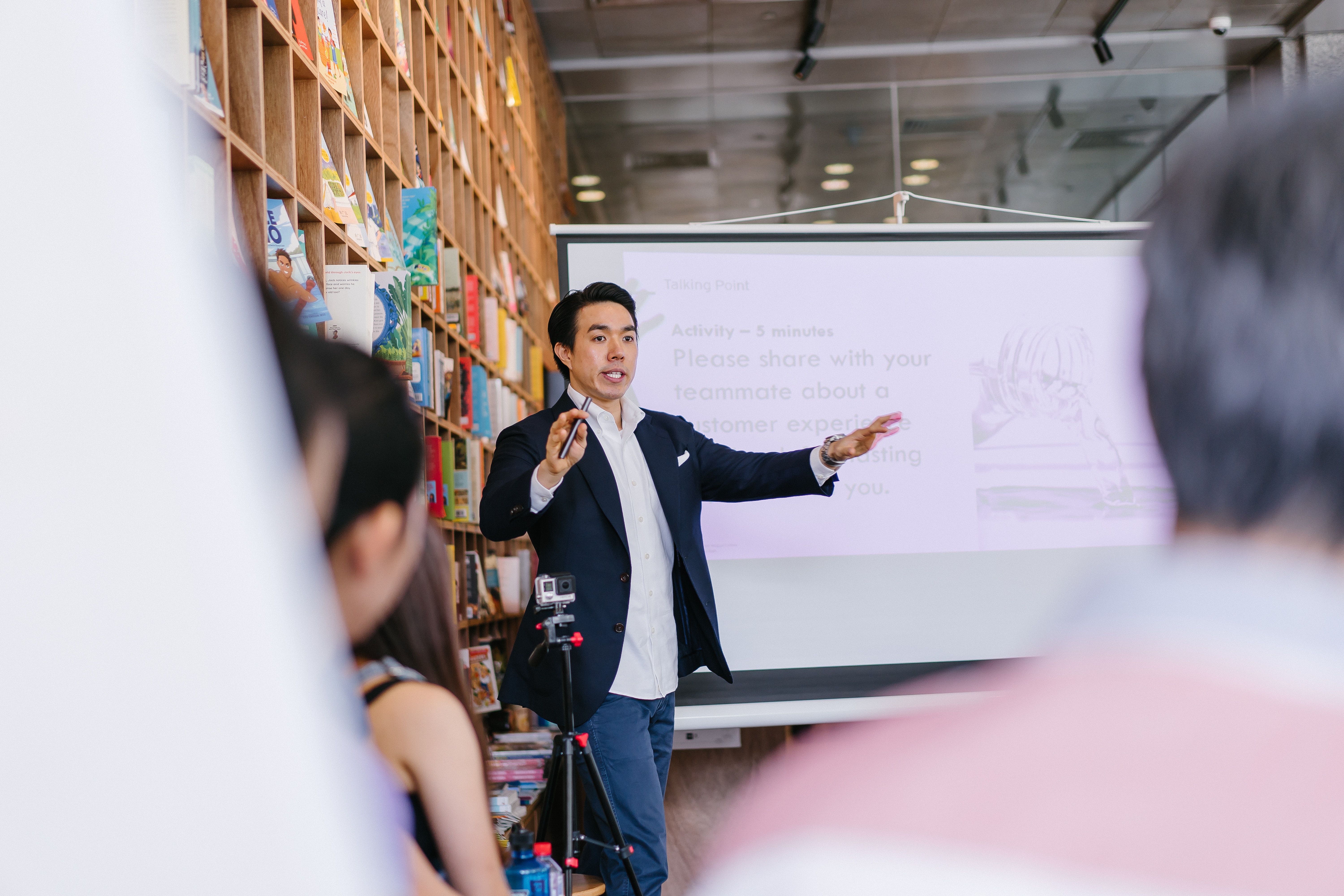 Man teaching  in front of screen 