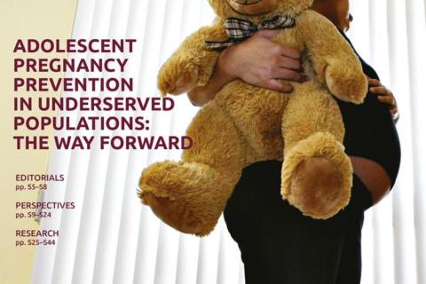 Cover of journal supplement with pregnant girl holding stuffed animal