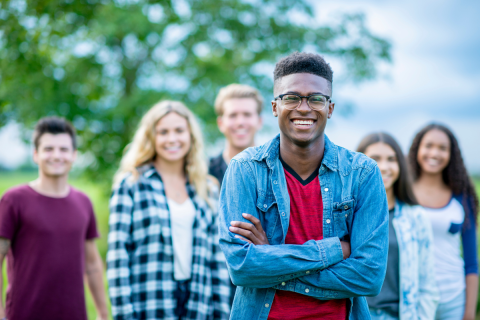 A group of youth with one teen in the foreground.