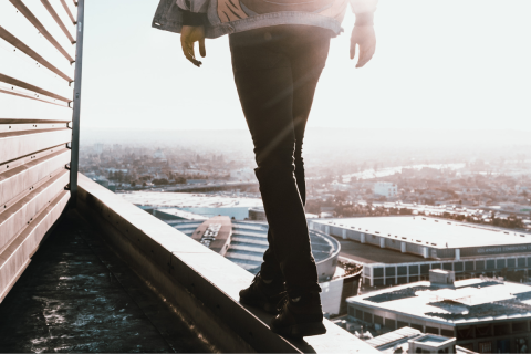 Person walking on a ledge