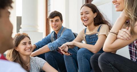 Image of a group of youth smiling. 