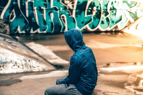 teen in park with graffiti