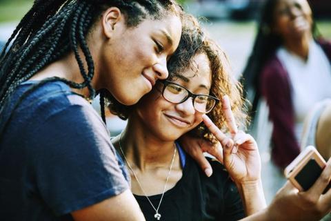 two girls taking selfie