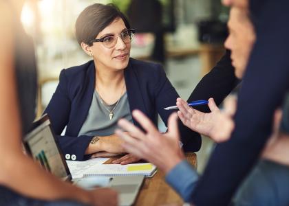 Woman listening during meeting.