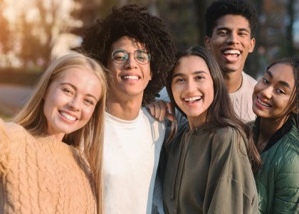 Photo of 5 diverse teens in the outdoors