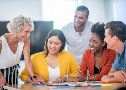 Four people collaborating at a table.