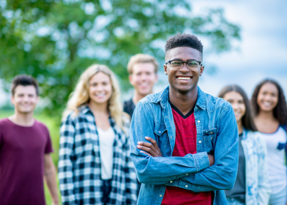 A group of youth with one teen in the foreground.