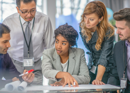 A group of diverse businesspeople meeting around a table.