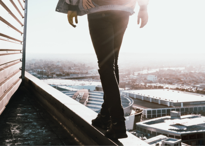 Person walking on a ledge