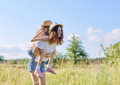 A pair of youth playing in an open field