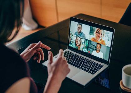 Professional on the computer video conferencing with others