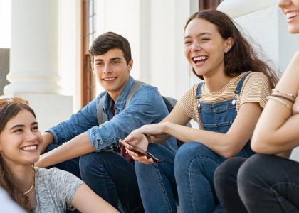 Image of a group of youth smiling. 