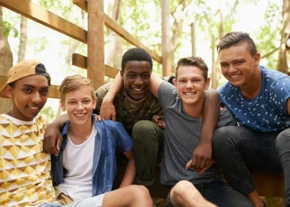 Diverse group of teen boys smiling