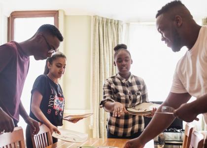 Young family setting the table together