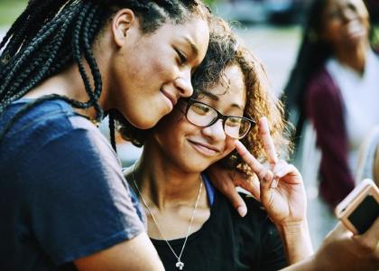 two girls taking selfie